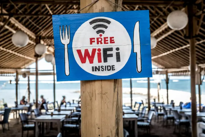 signboard of Free WiFi Free WiFi signage on wooden post